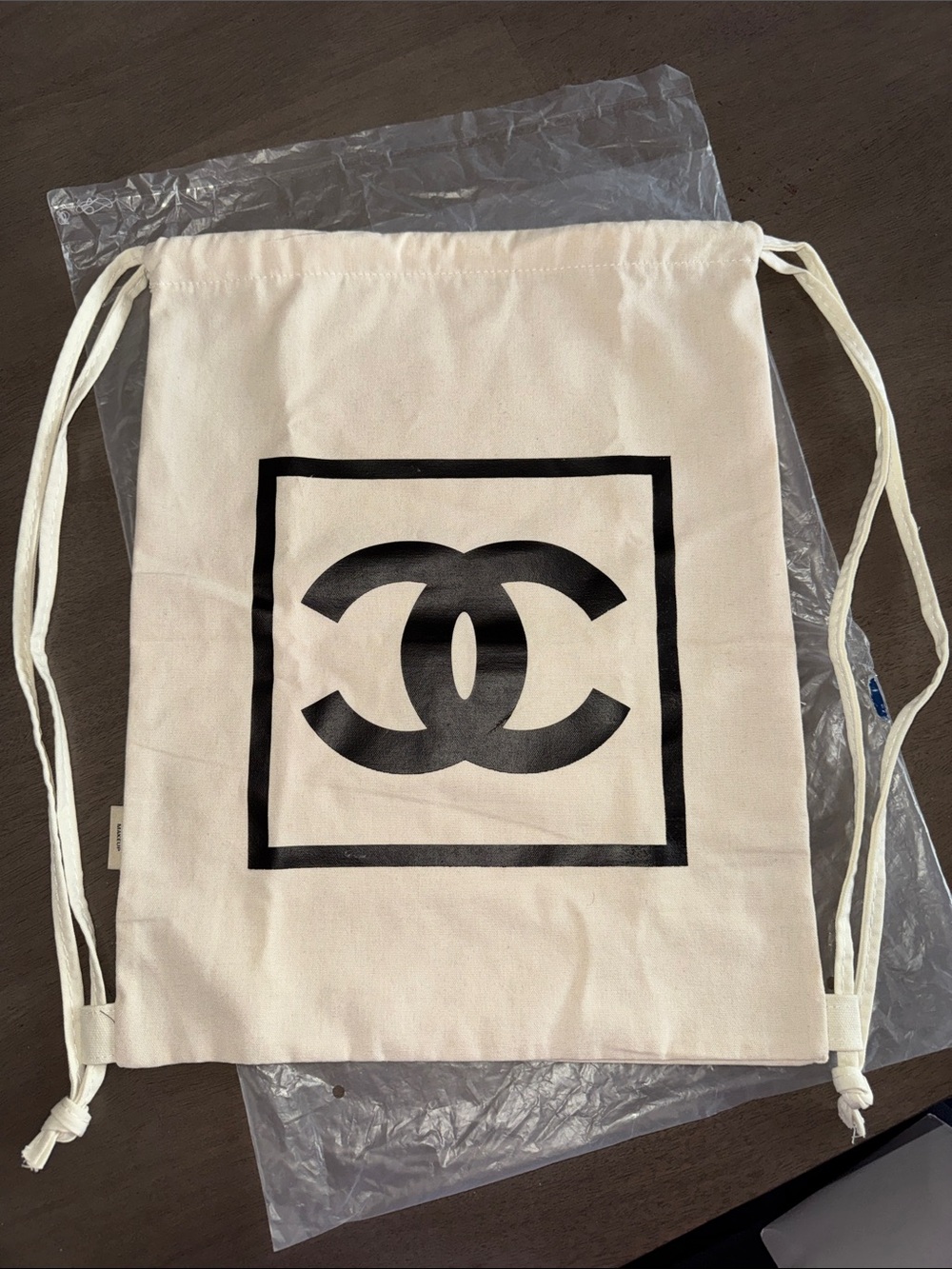 CHANEL Ivory Canvas Drawstring Bag with Black CC Logo